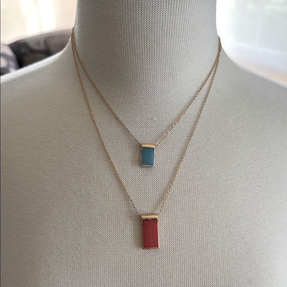 Gold Layered Necklace with Red and Blue Pendants.